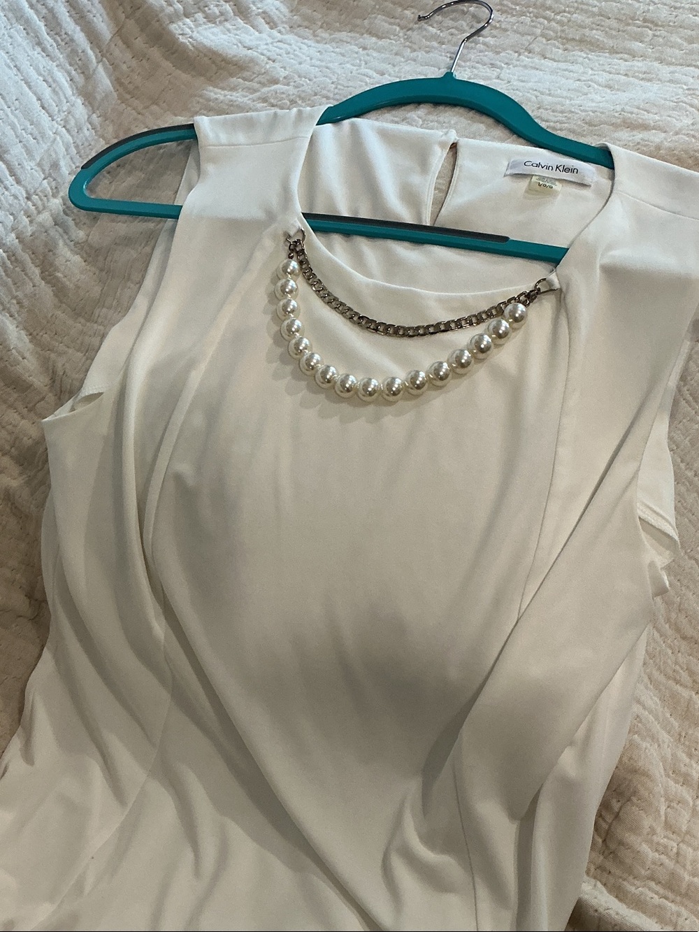Cream blouse with attached accessories